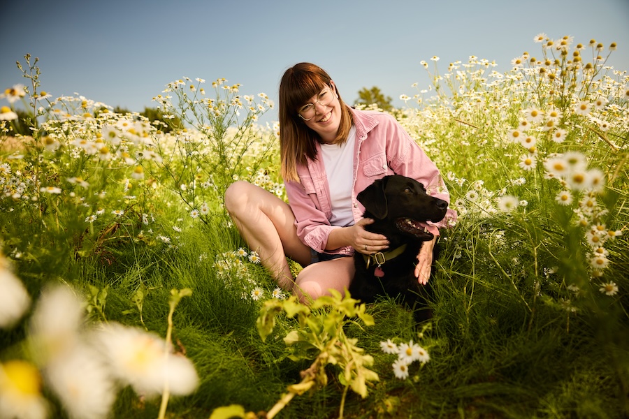 Woman smiling with her dog